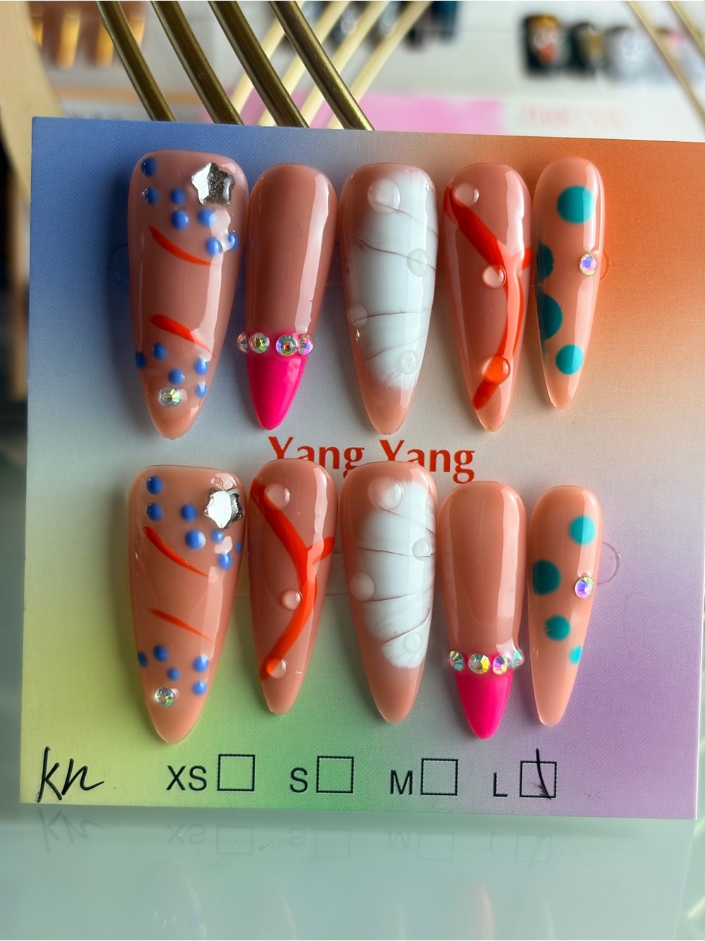 Nude & White Acrylic Stiletto Press-On Nails with Teal Dots & Pink Tips